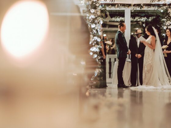 Bride and groom share their vows during their wedding ceremony in Crystal Plaza's Atrium.