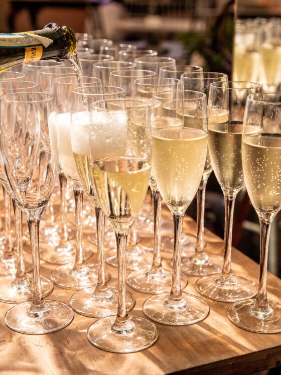 Champagne poured into flute glasses.