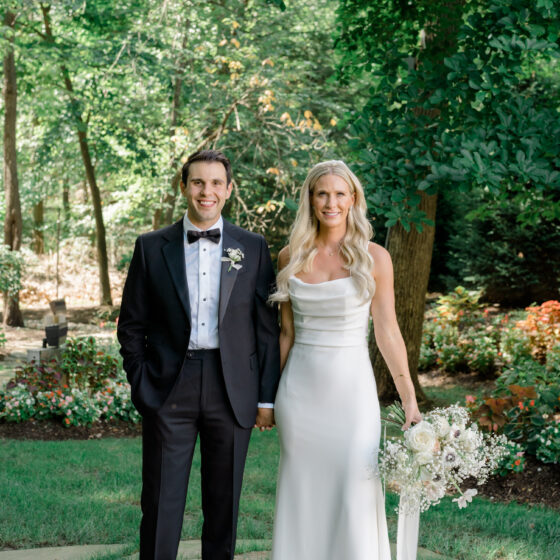 Elegant garden wedding photo of bride and groom.