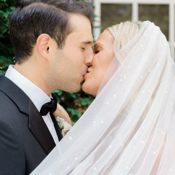 Bride and groom kiss.
