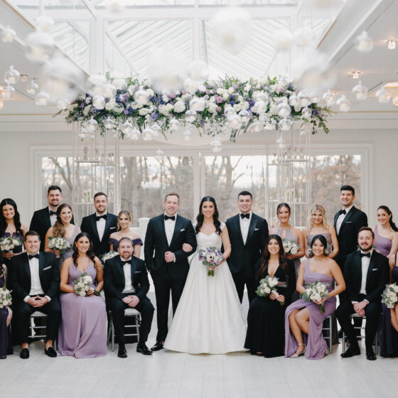 Wedding portrait with bride, groom, bridal party, and groomsmen in Crystal Plaza's Atrium.