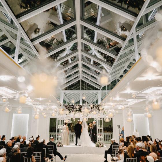 Romantic wedding ceremony in Crystal Plaza's Atrium venue space.