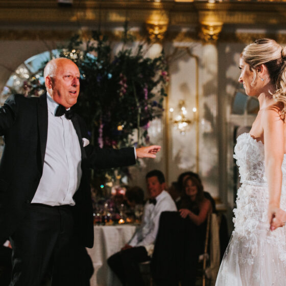 Father and daughter first dance during wedding reception.