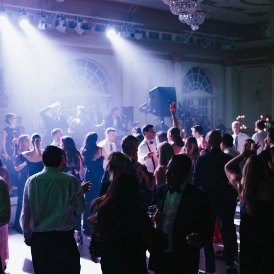 Wedding guests dancing on dance floor in Crystal Plaza's grand ballroom.