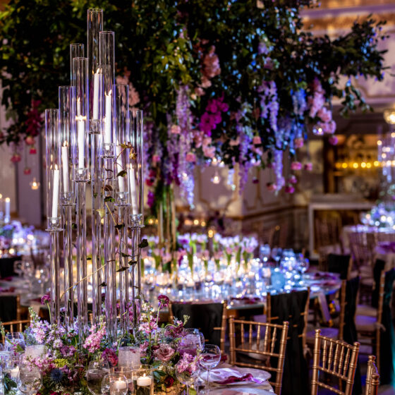 Candles complement romantic wedding reception decor in Crystal Plaza's grand ballroom.