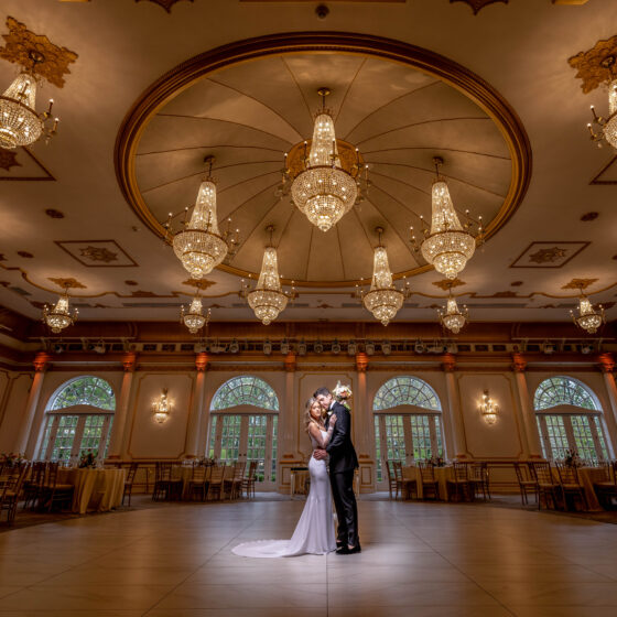 Bride and groom portrait in Crystal Plaza's grand ballroom.