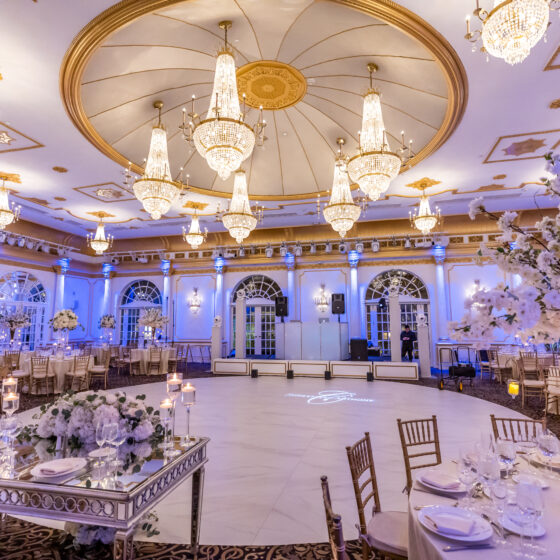 Luxurious white wedding reception decor.