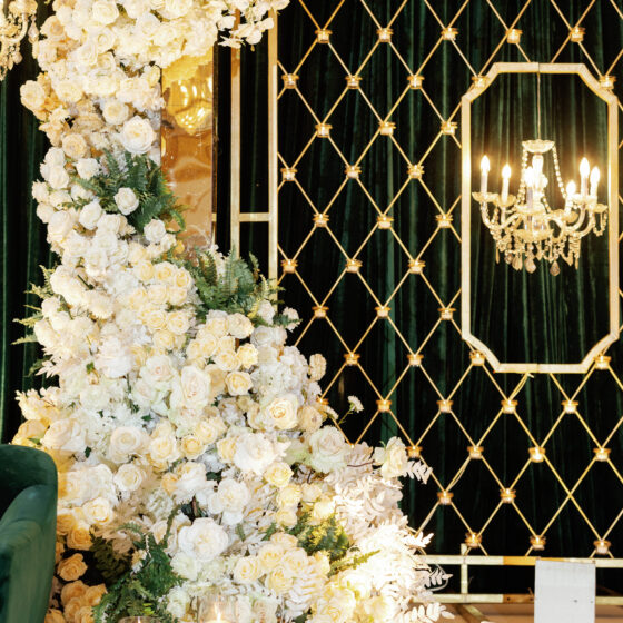 Elegant green velvet and floral wedding reception decor.