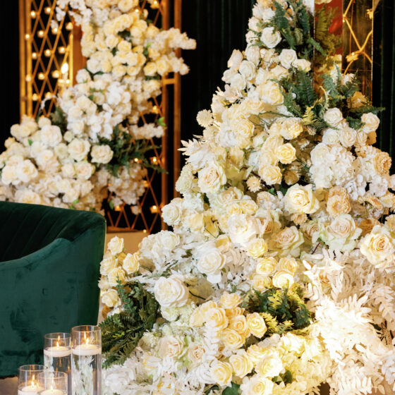 Elegant green velvet and floral wedding reception decor.